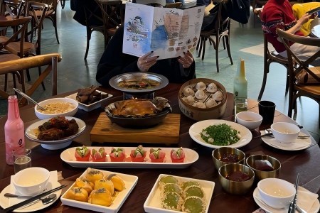 Abundant Table of Authentic Hangzhou Restaurant Dishes Full spread of classic Hangzhou cuisine, roast duck, dumplings, local snacks and side dishes at a city restaurant