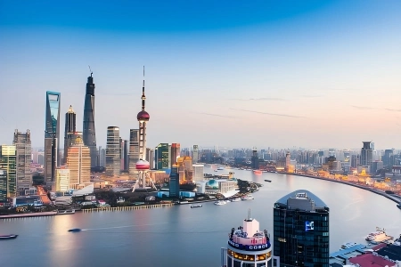 Aerial view of Lujiazui skyline with Oriental Pearl Tower over Huangpu River at dawn