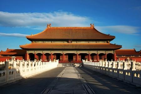 A view of the Forbidden City in Beijing featuring ancient Chinese palace halls and red walls