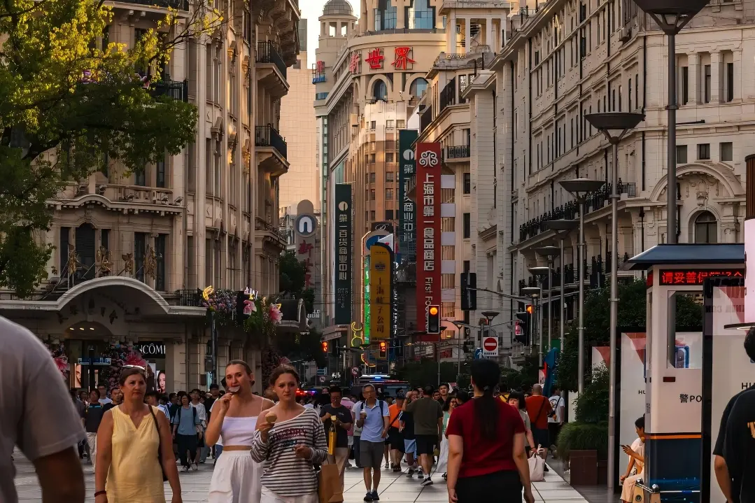 Crowded Nanjing Road pedestrian street with historic buildings in Shanghai