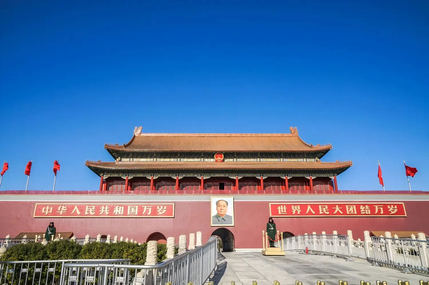 Front view of Tiananmen Gate under clear bright blue sky in Beijing