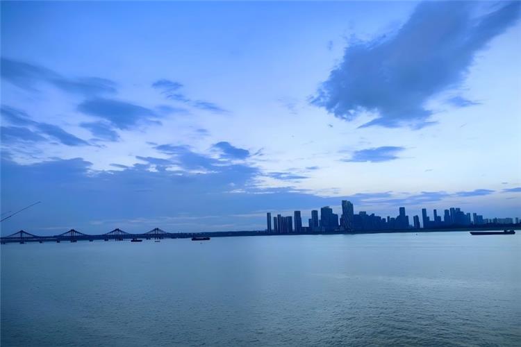 Qiantang River Tidal Sight Qiantang River in Hangzhou showing massive surging silver tidal wave rushing forward