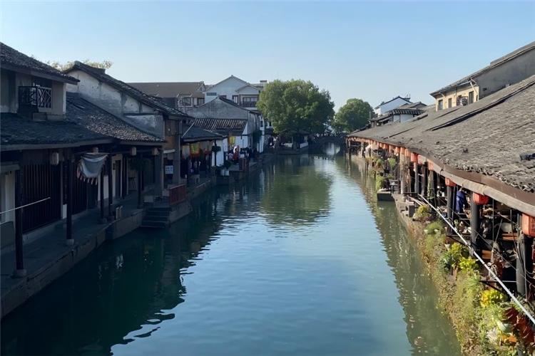 Anchang Ancient Town in Shaoxing Zhejiang featuring original well-preserved Ming-Qing Jiangnan canal town, covered waterfront corridors, stone arch bridges and authentic local folk customs