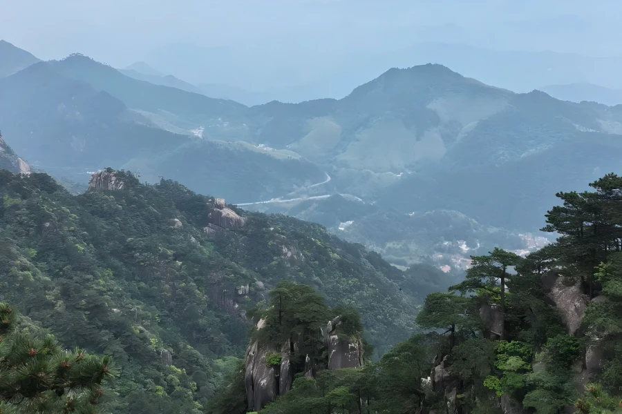 Anhui Mount Jiuhua Scenic Area Mount Jiuhua in Anhui showing one of China’s Four Sacred Buddhist Mountains, the sacred dojo of Ksitigarbha Bodhisattva, dotted with ancient Zen temples, sea of clouds, green pine peaks and well-preserved mummified monk Buddha shrines
