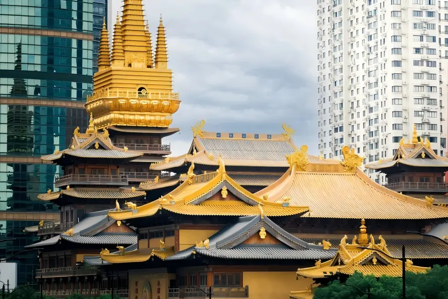 Jing'an Temple Jing'an Temple in Shanghai showcasing golden ancient Buddhist buildings standing amid modern downtown skyscrapers