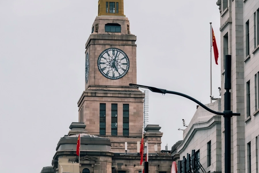 The Bund Customs Clock Tower Custom House Clock in Shanghai showcasing the iconic giant clock tower standing along the Bund beside Huangpu River