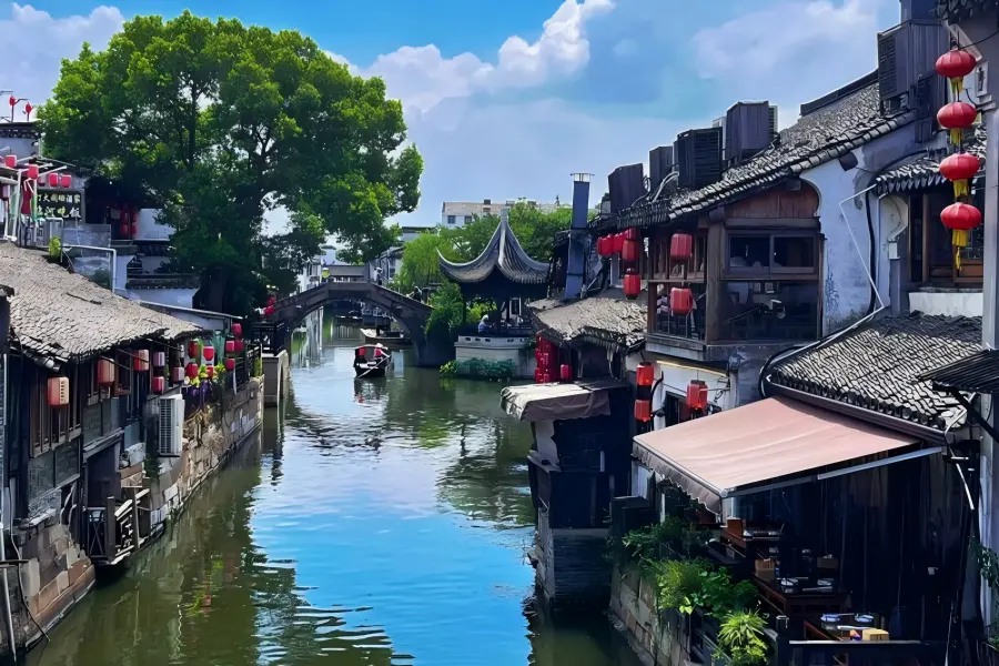 Living Millennium Water Town Xitang Xitang Ancient Town in Jiaxing featuring unique thousand-meter covered waterside corridors, labyrinthine narrow stone alleys and aged stone arch bridges lined with red lanterns along winding canals