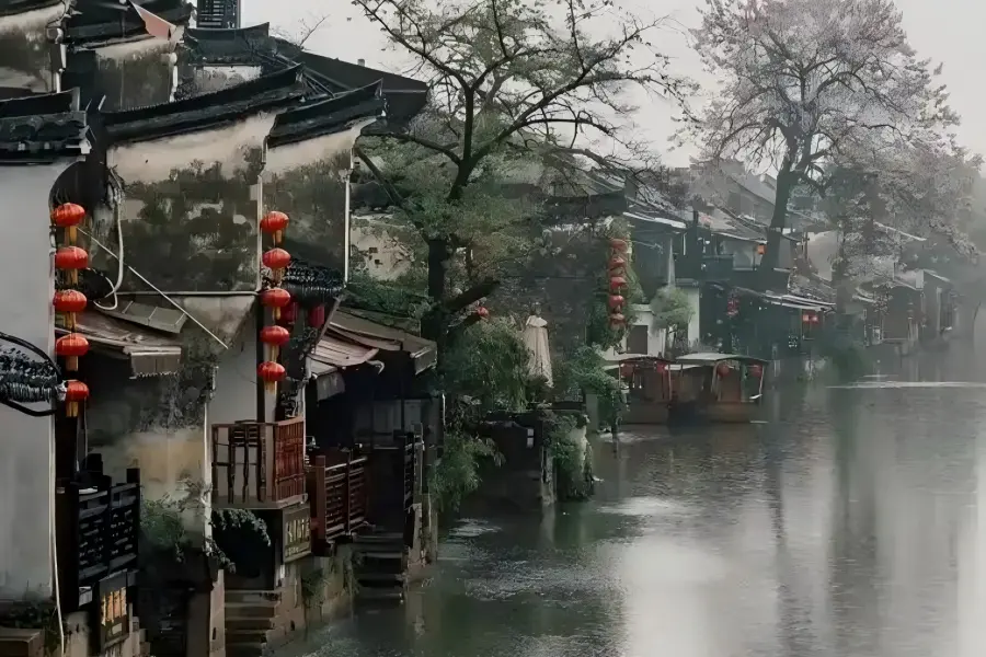 Iconic Misty Rain Corridor Xitang Ancient Town Xitang Ancient Town in Jiaxing boasts the world’s longest riverside covered misty rain corridor lined with wooden benches, alongside dense bluestone alleys and centuries-old stone arch bridges spanning winding waterways