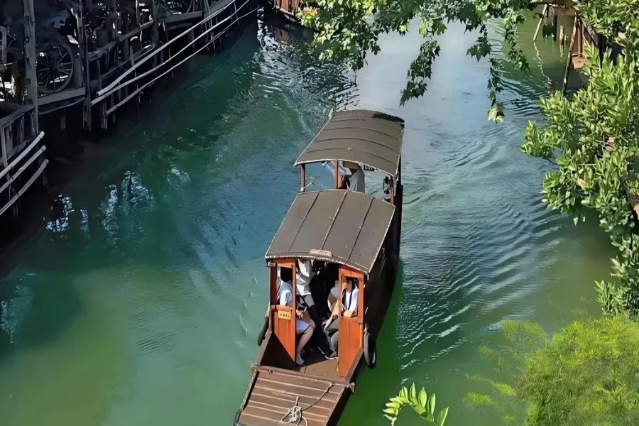 Intangible Cultural Heritage Water Town Xitang Jiaxing Xitang Ancient Town known as hometown of traditional Chinese fabric frog fasteners, showcasing tranquil river views, ancient private manors and slow drifting black-awning wooden boats