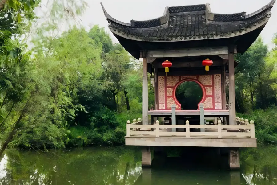 Xixi Water Village Folk Scenery Xixi Wetland in Hangzhou featuring quiet ancient water villages, wooden plank roads and scattered waterfront folk houses amid dense green woods