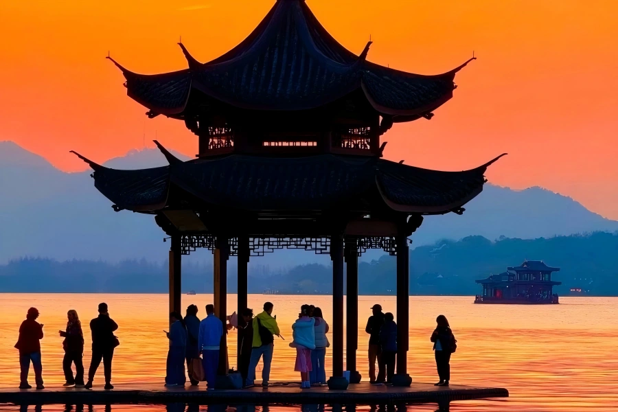 West Lake Sunset View West Lake in Hangzhou showing gorgeous sunset glow spreading over lake surface and distant hills