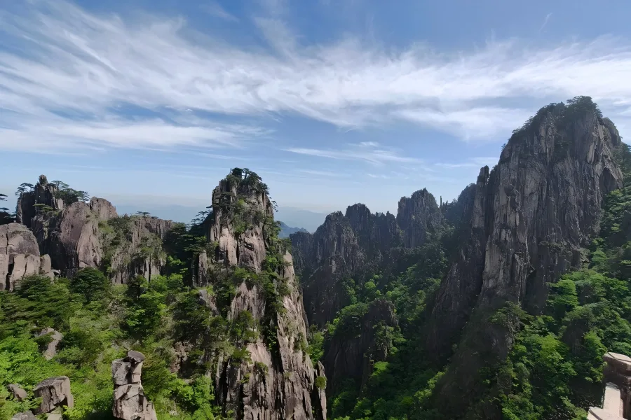 Yuping Pavilion on Huangshan Mountain showing the famous Guest-Greeting Pine on steep rocky cliffs