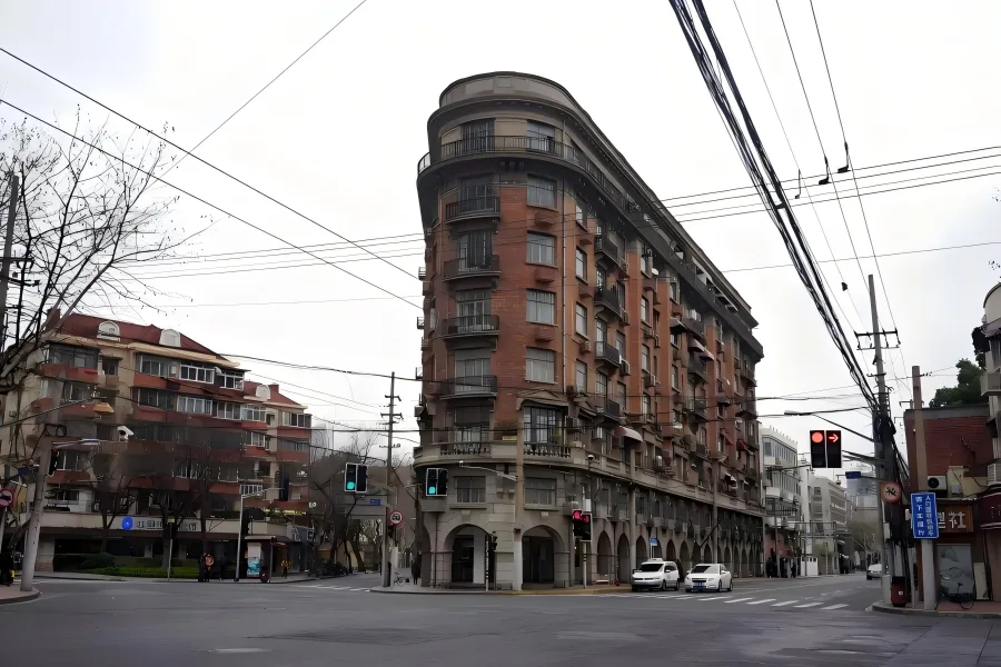 Wukang Mansion, iconic landmark in Shanghai’s former French Concession, designed by architect László Hudec with unique ship-shaped corner facade