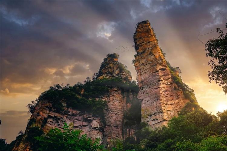 Epic sunset light hitting sharp karst mountain pillars in Zhangjiajie
