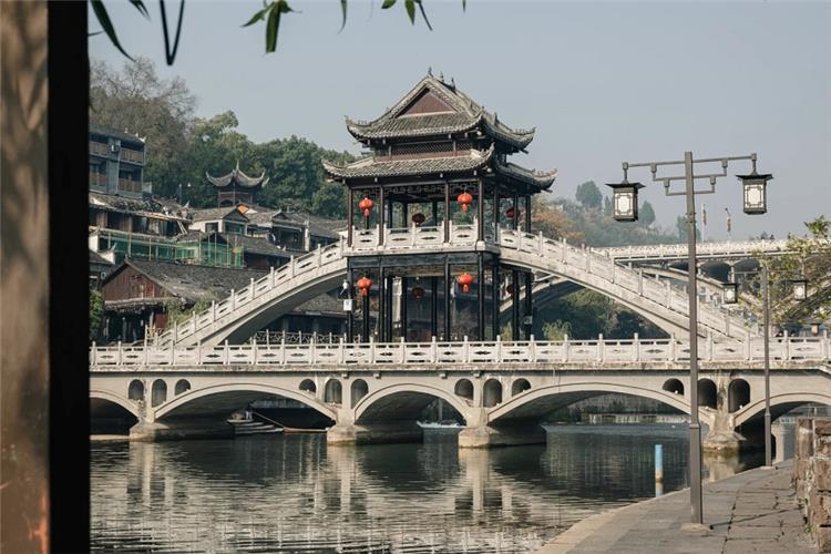 Historic pavilion?style stone bridge on Tuojiang River, Fenghuang water town Hunan