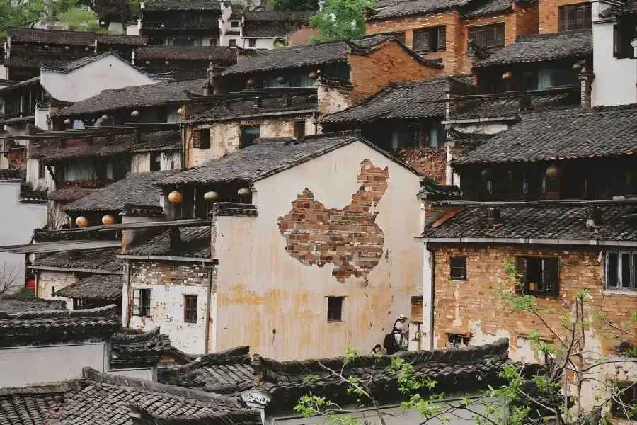 Wuyuan in Jiangxi presenting picturesque countryside scenery with old Hui?style dwellings and mountain valleys