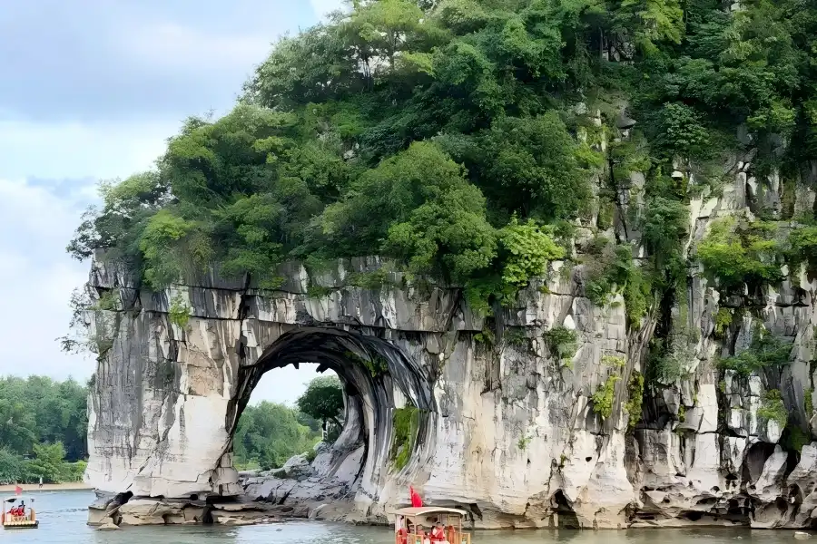 Elephant Trunk Hill Elephant Trunk Hill Scenic Area in Guangxi presenting Guilin’s city symbol, unique limestone rock formation standing gracefully along the riverside waterfront