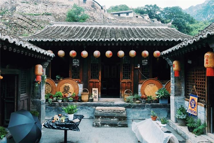 Traditional Courtyard in Cuanxia Ancient Village Chinese?style courtyard with hanging lanterns and antique decorations inside Cuanxia village house