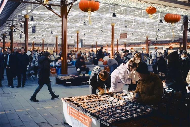 Panjiayuan Market Indoor Hall Spacious covered hall of Panjiayuan market, crowds of shoppers wandering among antique and craft vendor booths