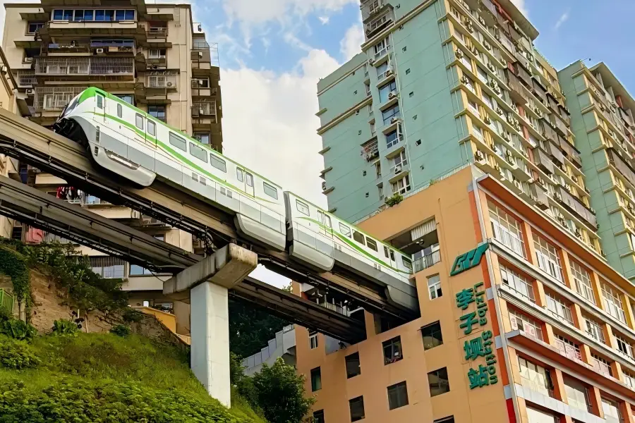 Liziba Station, Chongqing Liziba Monorail Station, monorail train passing through residential building, unique mountain?city engineering sight, Chongqing