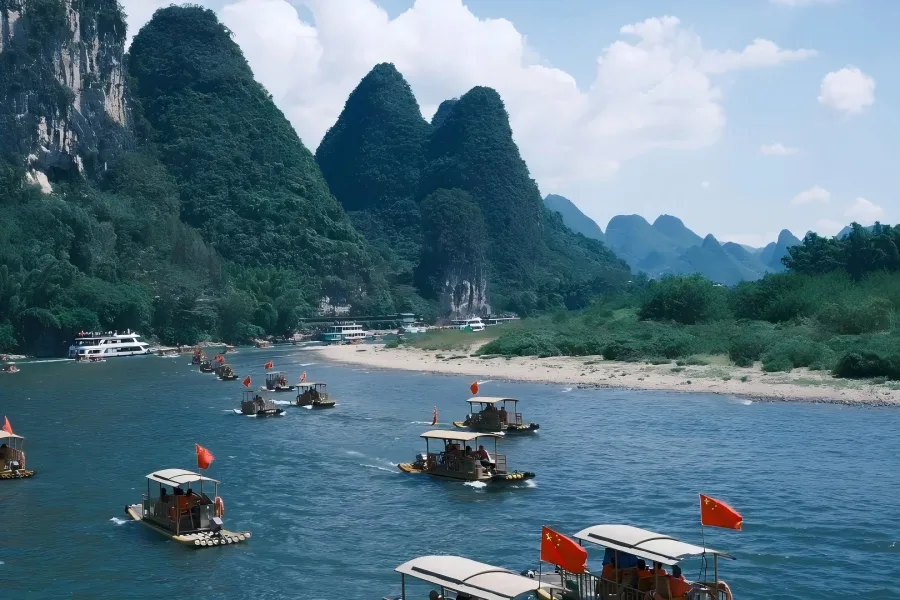Li River sightseeing cruise ship sailing amid towering karst peaks, iconic 20?yuan?note landscape, Guilin Guangxi