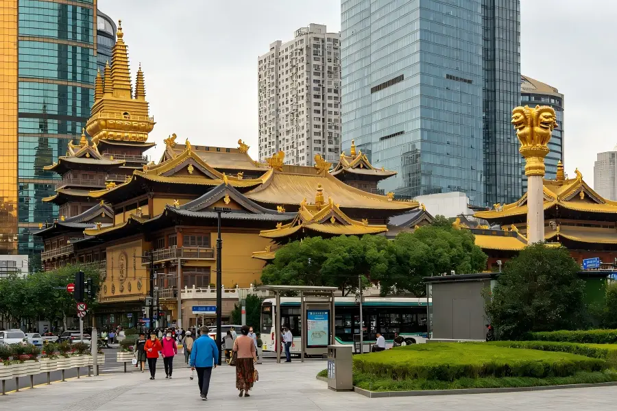 West Nanjing Road, sophisticated downtown boulevard blending luxury malls, historic villas and Jing’an Temple skyline, Shanghai urban commercial landmark