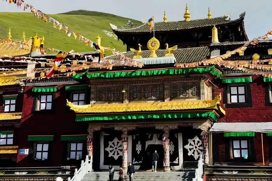 Tagong Temple,Sichuan Plateau Monastery Golden?roof Tagong Temple with prayer flags on highland grassland