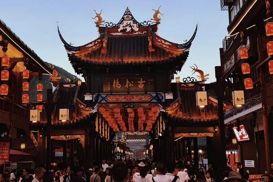 Multi?Cultural Songzhou Walled Settlement Songpan Ancient City in Aba depicting colourful prayer flags fluttering above old town lanes blending Tibetan, Hui and Han architectural features