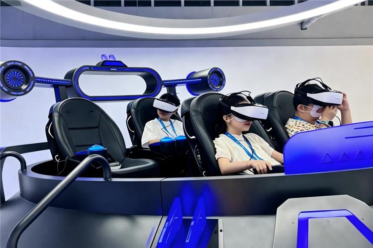 Kids enjoying immersive VR spaceship game at Hangzhou Qiushi AI museum