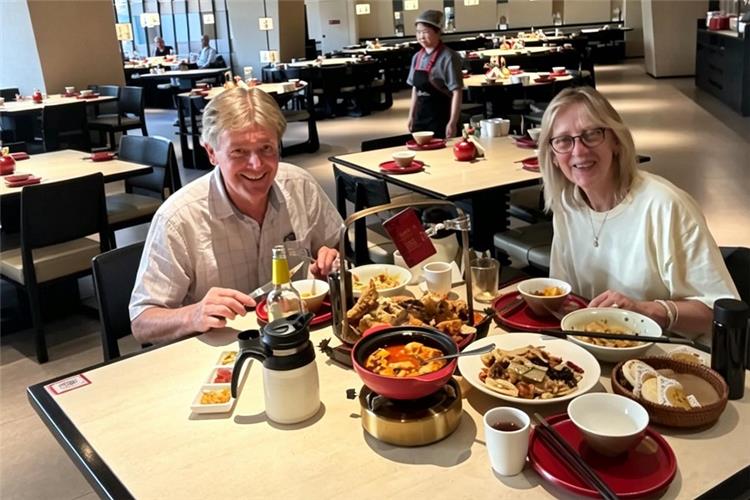 Tourists enjoying feast at Xi'an restaurant