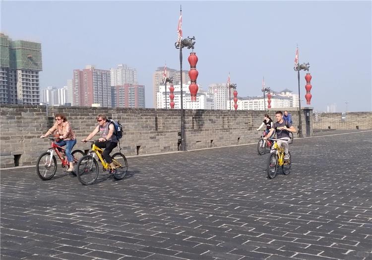 Xian City Wall Biking Tour Tourists cycling on Xian ancient city wall