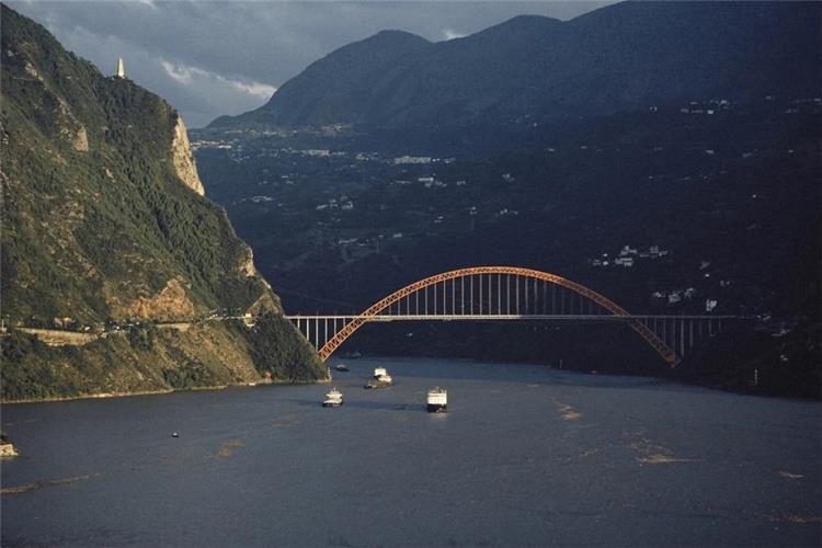 Arch bridge and cargo ships on Yangtze Three Gorges