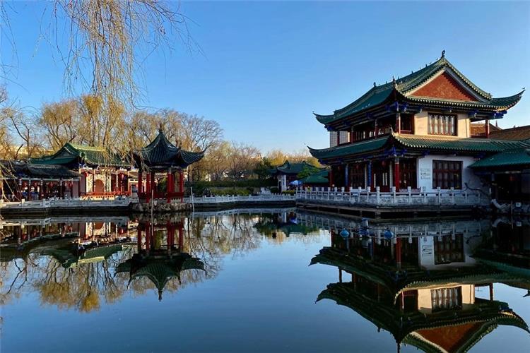 Traditional Chinese Garden, Kunming Ancient pavilions with perfect water reflection, peaceful classical garden scenery
