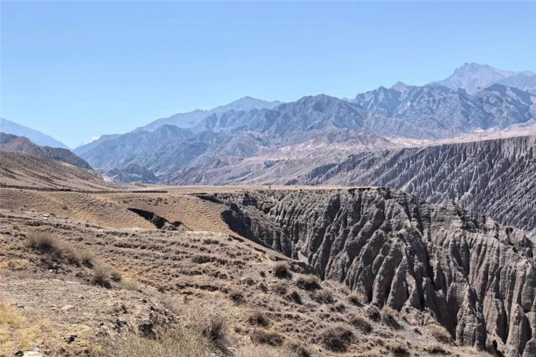 Majestic Dushanzi grand canyon, eroded rock formations and barren Tianshan foothills under clear blue sky Xinjiang