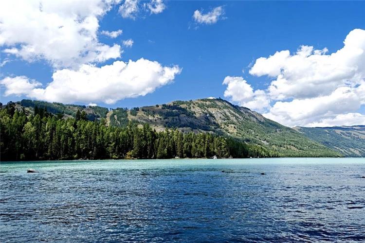 Kanas Alpine Lake, Taiga Forest Altay Mountains Xinjiang Crystal blue?green Kanas Lake surrounded by dense coniferous taiga forest, Altay mountain range, Xinjiang natural scenery