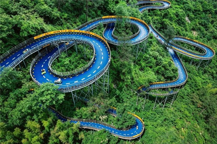 Aerial view of winding blue mountain slides at Hangzhou OMG Heartbeat Park