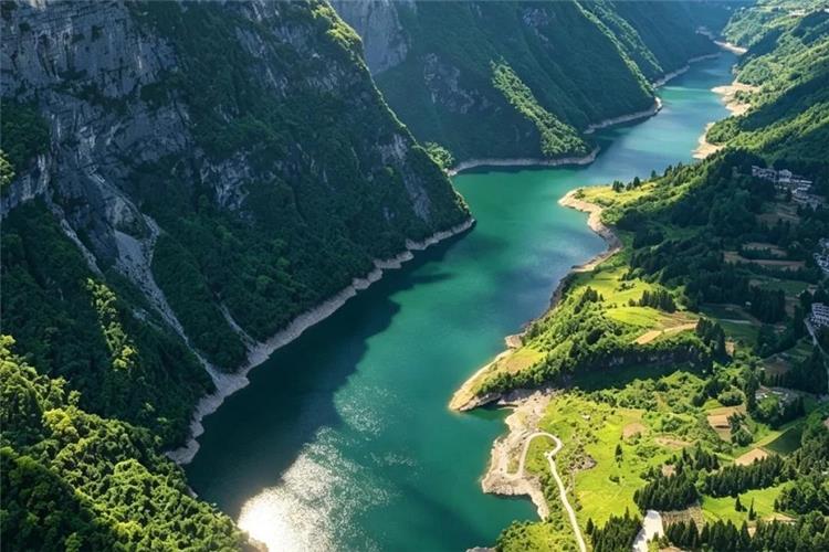 Overlook of winding Qingjiang river, sheer rocky cliffs, lush green hills and riverside farmland in Enshi