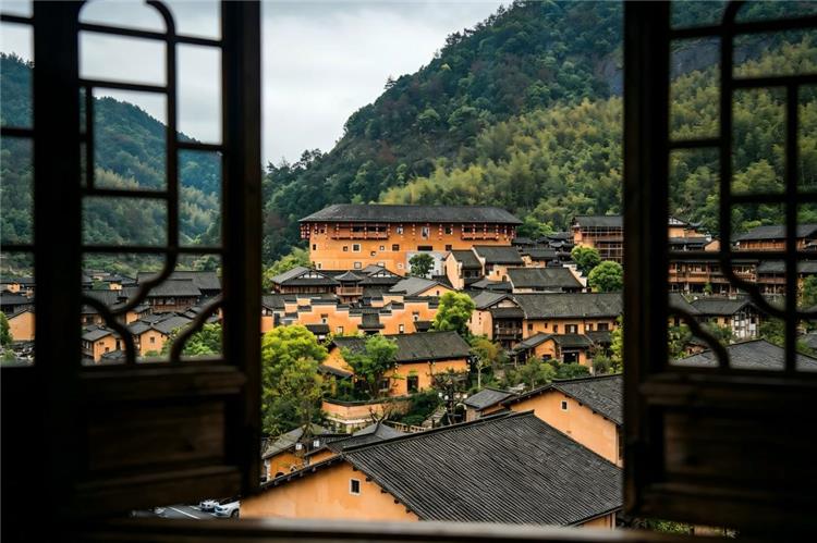 Wangxiangu Day View Wangxiangu valley viewed through a wooden window with mountain village buildings