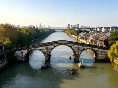 Three-arch stone bridge and boats on Grand Canal