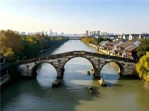 Three-arch stone bridge and boats on Grand Canal