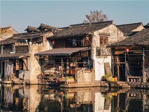 Lesser-crowded Nanxun Water Town Landscape Featuring Old Riverside Houses and Tranquil Canal Reflections