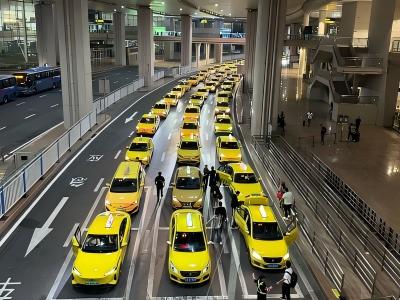 Chongqing yellow taxis lined up at a modern transport hub, showing the city's unique urban traffic scene