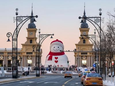 Huge snowman with red scarf at Harbin Music Corridor