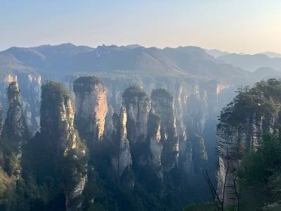 Sunrise over Zhangjiajie sandstone pillars and mountain peaks in China’s National Forest Park