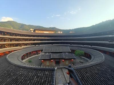 Interior courtyard of a traditional Fujian Tulou with wooden balconies and circular architecture in Fujian