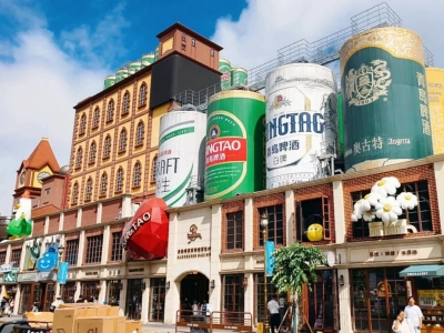 Exterior view of Tsingtao Beer Museum with giant beer cans decorations