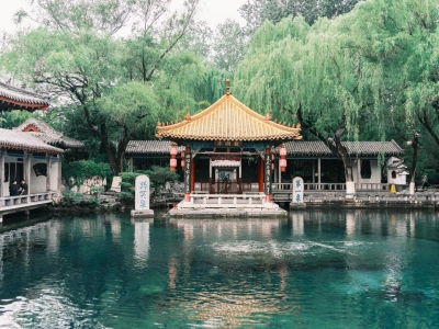 Classical Chinese pavilion and clear spring water at Baotu Spring Park, Jinan