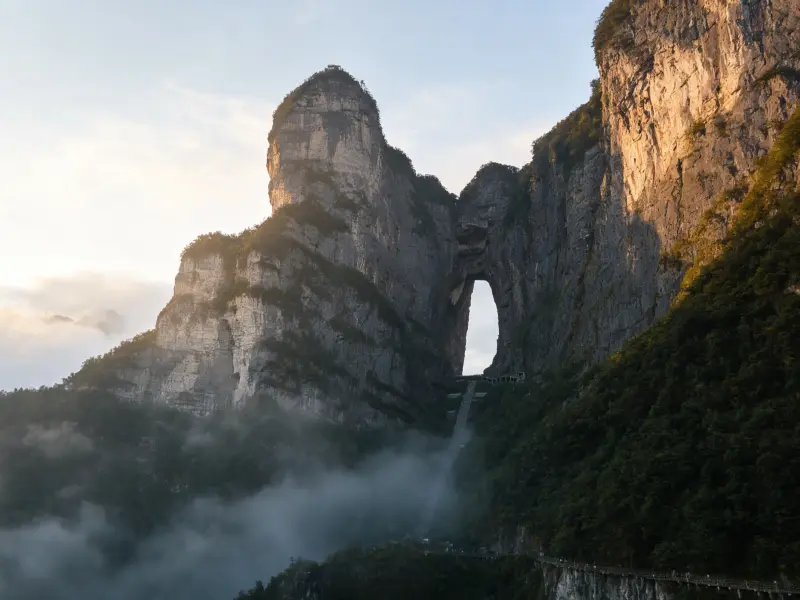 Spectacular natural stone arch?Tianmen Cave, steep limestone cliffs, famous mountain sightseeing destination in Hunan
