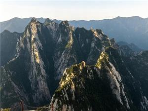Dramatic mountain peaks and rugged cliffs of Mount Hua in China under a clear sky