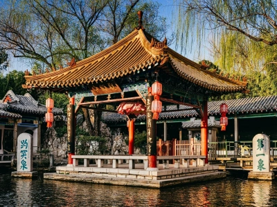 Traditional Chinese pavilion at Baotu Spring park, historic stone steles, Jinan Shandong